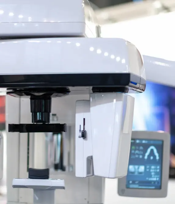 Modern dental imaging equipment with digital display screen at Williamson dental practice.